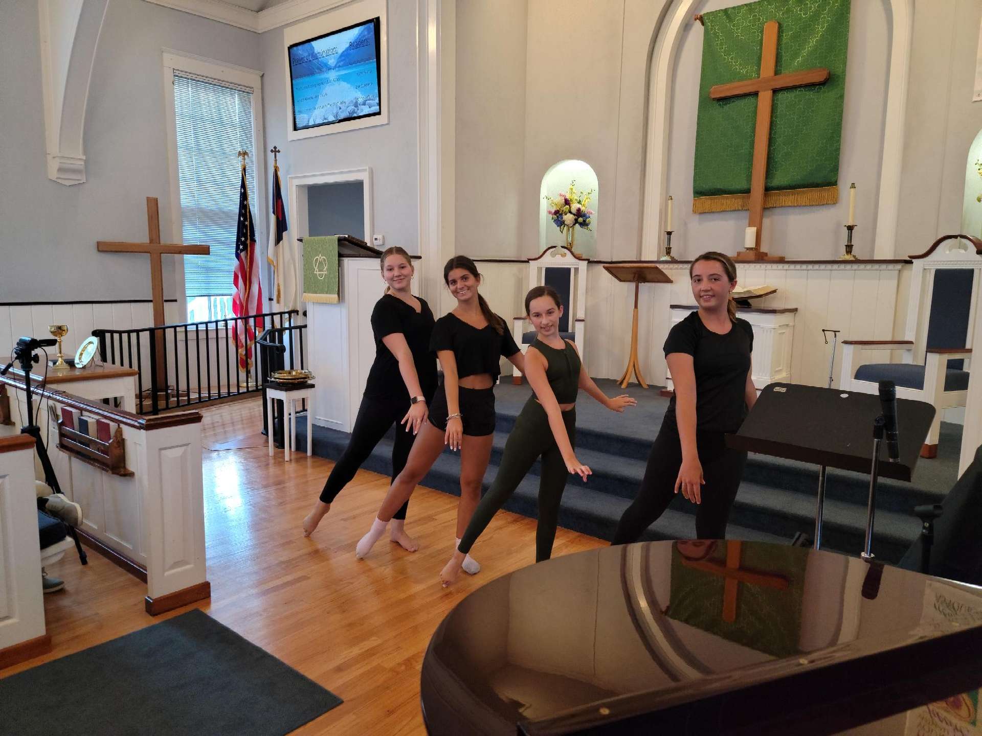 Girls dancing to music of God in sanctuary